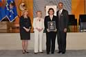 Barri Rosenbluth, recipient of the Award for Professional Innovation in Victim Services, with (from left) Joye E. Frost, Acting Director, Office for Victims of Crime; Assistant Attorney General Laurie O. Robinson, Office of Justice Programs; and U.S. Attorney General Eric H. Holder, Jr.