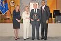 Ronald Wilson Reagan Public Policy Award recipient Larry Tackman with (from left) Joye E. Frost, Acting Director, Office for Victims of Crime; Assistant Attorney General Laurie O. Robinson, Office of Justice Programs; and U.S. Attorney General Eric H. Holder, Jr.