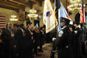 Photo of attendees of the 2011 National Observance and Candlelight Ceremony listening to the National Anthem.