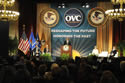 Photo of U.S. Attorney General Eric H. Holder, Jr., addressing attendees at the 2011 National Observance and Candlelight Ceremony. Also on stage are (from left) Ronald C. Machen, Jr., U.S. Attorney for the District of Columbia; Joye E. Frost, Acting Director, Office for Victims of Crime; Assistant Attorney General Laurie O. Robinson, Office of Justice Programs; and keynote speaker Judy Shepard.