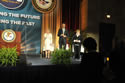 Photo of U.S. Attorney General Eric H. Holder, Jr., observing a moment of silence with Assistant Attorney General Laurie O. Robinson, Office of Justice Programs (left), and keynote speaker Judy Shepard.