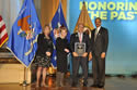 Photo of the Honorable Ronald Reinstein receiving the Allied Professional Award with (from left) Joye E. Frost, Acting Director, Office for Victims of Crime; Assistant Attorney General Laurie O. Robinson, Office of Justice Programs; and U.S. Attorney General Eric H. Holder, Jr.