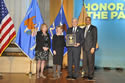 Photo of Federal Service Award recipient Robert S. Mueller, III, Director, Federal Bureau of Investigation, standing with (from left) Joye E. Frost, Acting Director, Office for Victims of Crime; Assistant Attorney General Laurie O. Robinson, Office of Justice Programs; and U.S. Attorney General Eric H. Holder, Jr.