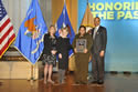 Photo of Special Courage Award recipient Nicole M. Robinson standing with (from left) Joye E. Frost, Acting Director, Office for Victims of Crime; Assistant Attorney General Laurie O. Robinson, Office of Justice Programs; and U.S. Attorney General Eric H. Holder, Jr.