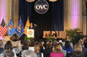 Photo of U.S. Attorney General Eric H. Holder, Jr., addressing attendees of the 2012 National Crime Victims’ Service Awards Ceremony. Also on stage are (from left) Joye E. Frost, Acting Director, Office for Victims of Crime; and Acting Assistant Attorney General Mary Lou Leary, Office of Justice Programs.