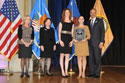 Photo of Rachel Lloyd accepting the National Crime Victim Service Award for Girls Educational and Mentoring Services accompanied by Janice Holzman with Joye E. Frost, Acting Director, Office for Victims of Crime; Acting Assistant Attorney General Mary Lou Leary, Office of Justice Programs; and U.S. Attorney General Eric H. Holder, Jr.