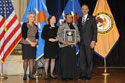 Photo of National Crime Victim Service Award recipient Victoria Cruz with (from left) Joye E. Frost, Acting Director, Office for Victims of Crime; Acting Assistant Attorney General Mary Lou Leary, Office of Justice Programs; and U.S. Attorney General Eric H. Holder, Jr.