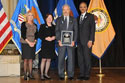 Photo of Bruce Ross accepting the Special Courage Award for Mickey Rooney with (from left) Joye E. Frost, Acting Director, Office for Victims of Crime; Acting Assistant Attorney General Mary Lou Leary, Office of Justice Programs; and U.S. Attorney General Eric H. Holder, Jr.