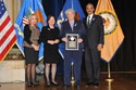 Photo of Federal Service Award recipient Roi Holt with (from left) Joye E. Frost, Acting Director, Office for Victims of Crime; Acting Assistant Attorney General Mary Lou Leary, Office of Justice Programs; and U.S. Attorney General Eric H. Holder, Jr.