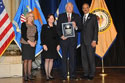 Photo of Crime Victims Financial Restoration Award recipient G. Wingate Grant with (from left) Joye E. Frost, Acting Director, Office for Victims of Crime; Acting Assistant Attorney General Mary Lou Leary, Office of Justice Programs; and U.S. Attorney General Eric H. Holder, Jr.