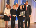 Accepting an award on behalf of the Boston Area Rape Crisis Center (BARCC), Gina Scaramella is pictured with (from left) Joye E. Frost, Acting Director, Office for Victims of Crime; Laurie O. Robinson, Acting Assistant Attorney General, Office of Justice Programs; and U.S. Attorney General Eric H. Holder, Jr.