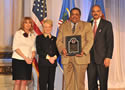 Award recipient Kenneth Barnes, with (from left) Joye E. Frost, Acting Director, Office for Victims of Crime; Laurie O. Robinson, Acting Assistant Attorney General, Office of Justice Programs; and U.S. Attorney General Eric H. Holder, Jr.