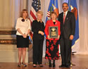 Award recipient Frank Marion displays his award with (from left) Joye E. Frost, Acting Director, Office for Victims of Crime; Laurie O. Robinson, Acting Assistant Attorney General, Office of Justice Programs; William Gilligan, Chief, U.S. Postal Inspection Service; and U.S. Attorney General Eric H. Holder, Jr.