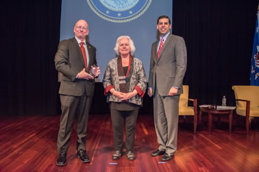 Allied Professional Award recipient Captain Michael Holt with (from left) Acting OVC Director Marilyn McCoy Roberts and Acting Associate Attorney General Jesse Panuccio.