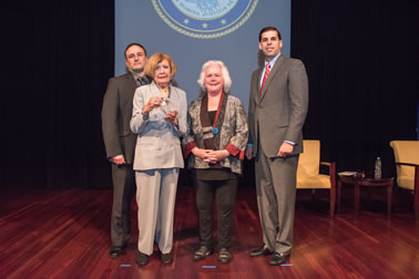 The family of the late Teresa P. Scalzo accept the Ronald Wilson Reagan Public Policy Award at the National Crime Victim Service Awards. Pictured from left: Carl Scalzo, Marie Scalzo, Acting OVC Director Marilyn McCoy Roberts and Acting Associate Attorney General Jesse Panuccio.