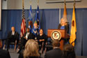 Photo of Joye E. Frost, Principal Deputy Director, Office for Victims of Crime addressing attendees at 2013 awards ceremony. Also on stage are (from left) U.S. Attorney General Eric H. Holder Jr., Associate Attorney General Tony West, and Assistant Attorney General Mary Lou Leary, Office of Justice Programs.
