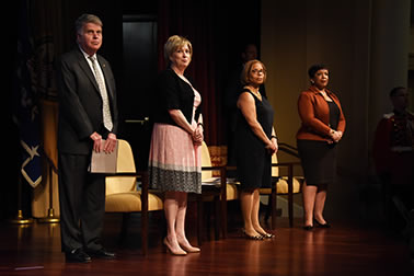 David S. Ferriero, Archivist of the United States, National Archives and Records Administration; Joye E. Frost, Director, Office for Victims of Crime; Karol V. Mason, Assistant Attorney General; and Attorney General Loretta E. Lynch stand for the National Anthem at the National Crime Victims’ Service Awards Ceremony.