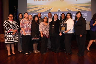 Choctaw Nation Victim Services received the Award for Professional Innovation in Victim Services at the National Crime Victims’ Service Award Ceremony. Back row (from left): Tasha Mitchell, Bruce Frazier, Jimmy Smith, Randy Hammons, Darryl Brown. (from left): Consuelo Splawn, Cheselene Carter, Connie Courtwright, Sarah Trusty, Linda Goodwin Sr., Vicki Perez, and Teola Durant.