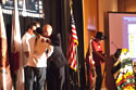 Larry Echo Hawk, Assistant Secretary for Indian Affairs, U.S. Department of the Interior, receiving congratulations from The Boyz after being presented with an eagle feather by Jim Clairmont at the conclusion of his closing keynote address on December 11, 2010, at the 12th National Indian Nations conference.