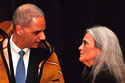 U.S. Attorney Eric Holder, Jr., receiving the honor blanket from Abby Abinanti, Superior Court Commissioner in California and Chief Judge at Yurok, shown in photo, and LaVonne Peck, Tribal Chair for the La Jolla Band of Luiseno Indians.