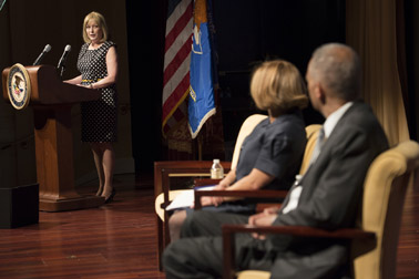 Photo of the welcoming remarks by OVC Director Joye E. Frost. Pictured on stage are Attorney General Eric H. Holder, Jr. and Assistant Attorney General Karol V. Mason.