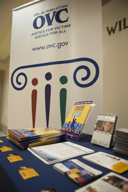 Photo of the 2015 National Crime Victims’ Rights Week Resource Guide and other materials highlighting new products and information available from OVC at the exhibit table outside the William G. McGowan Theater at the National Crime Victims’ Service Awards Ceremony.