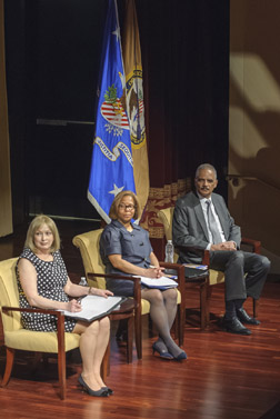 Photo of Attorney General Eric H. Holder, Jr., Assistant Attorney General Karol V. Mason, and OVC Director Joye E. Frost on stage at the ceremony.