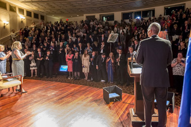 Photo of Attorney General Eric H. Holder, Jr. addressing attendees at the National Crime Victims’ Service Awards Ceremony. Pictured on stage are Assistant Attorney General Karol V. Mason and OVC Director Joye E. Frost.