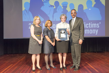 Photo of National Crime Victim Service Award recipient Karen Irene Kalergis with (from left) Joye E. Frost, Director, Office for Victims of Crime; Karol V. Mason, Assistant Attorney General, and Attorney General Eric H. Holder, Jr.