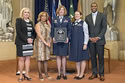 Photo of Col. Dawn Hankins and Captain Allison DeVito accepting the Federal Service Award for the United States Air Force Special Victims' Counsel Program, with Joye E. Frost, Director, Office for Victims of Crime; Karol V. Mason, Assistant Attorney General, Office of Justice Programs; and Associate Attorney General Tony West.