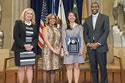 Photo of Crime Victims Financial Restoration Award recipient Mi Yung Claire Park with (from left) Joye E. Frost, Director, Office for Victims of Crime; Karol V. Mason, Assistant Attorney General, Office of Justice Programs; and Associate Attorney General Tony West.