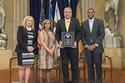 Photo of Special Courage Award recipient Paul Traub with (from left) Joye E. Frost, Director, Office for Victims of Crime; Karol V. Mason, Assistant Attorney General, Office of Justice Programs; and Associate Attorney General Tony West.